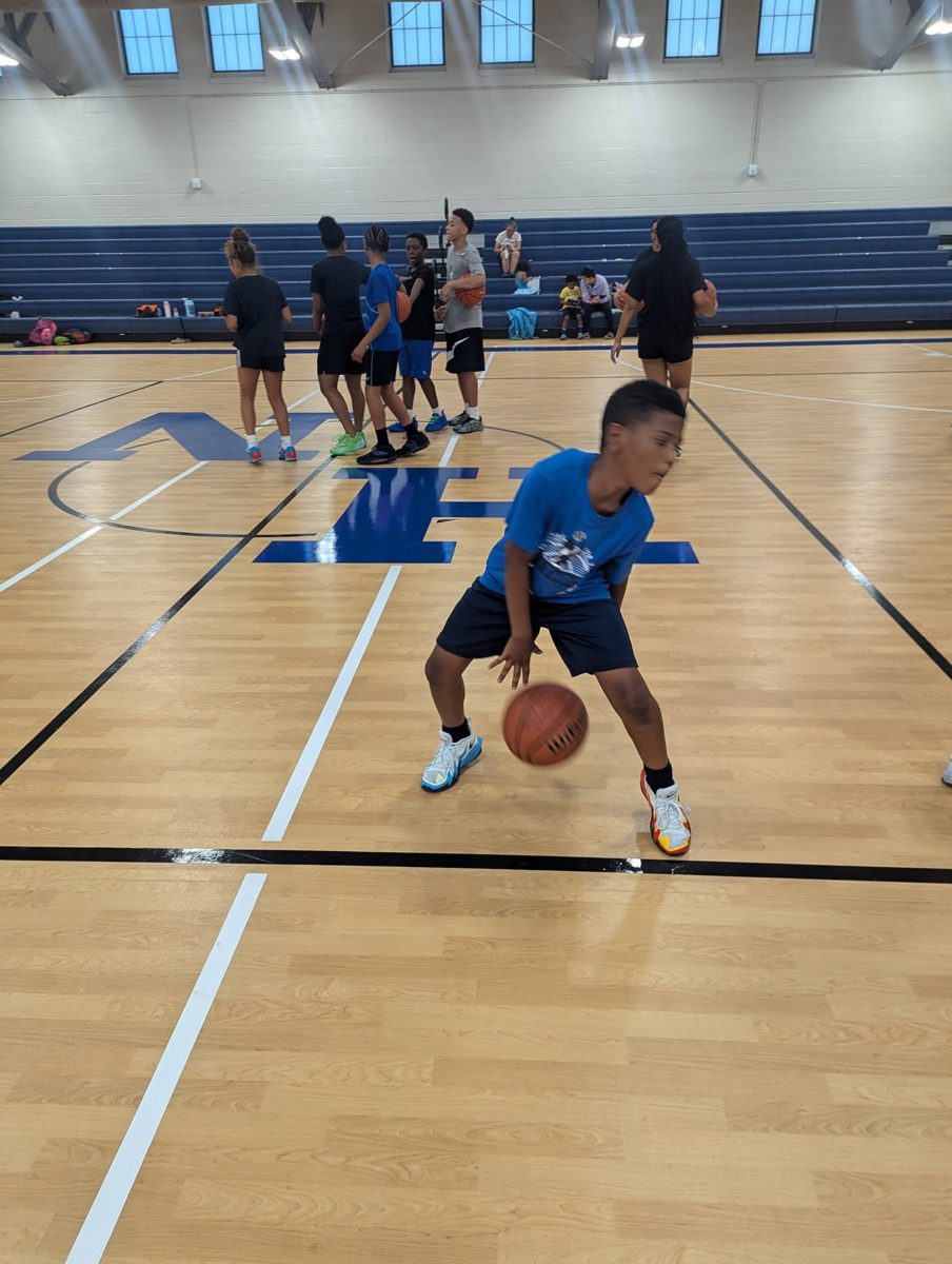 A young CMA athlete working on a low crossover dribble during Academy training