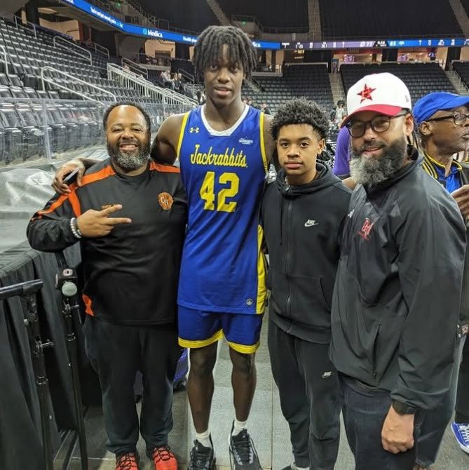 Coach Moe with one of his athletes after a game