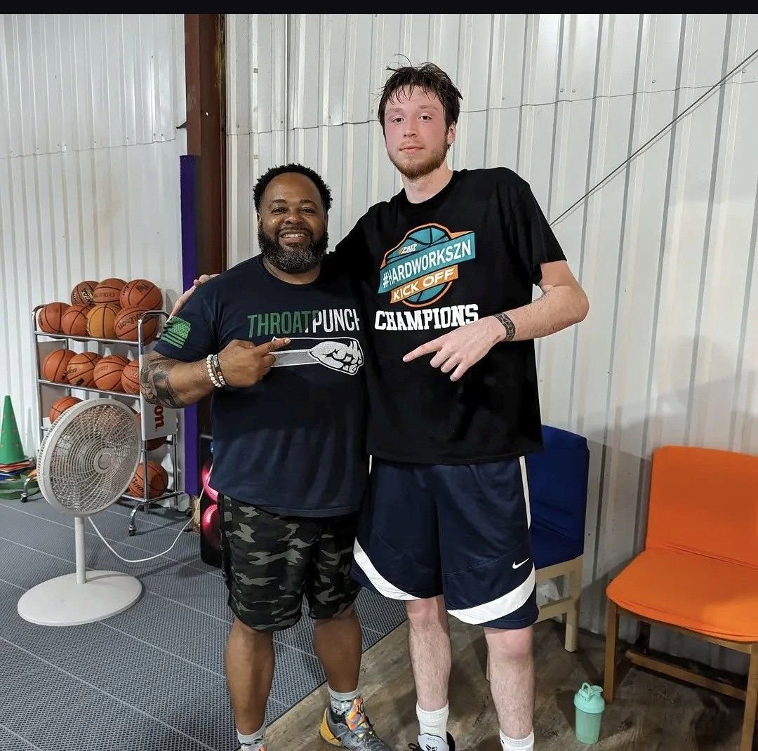 Coach Moe with one of his athletes in the CMA training gym